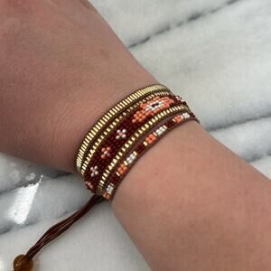 Red, orange and gold beaded adjustable bracelet